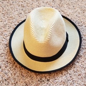 Straw hat with black trim and band